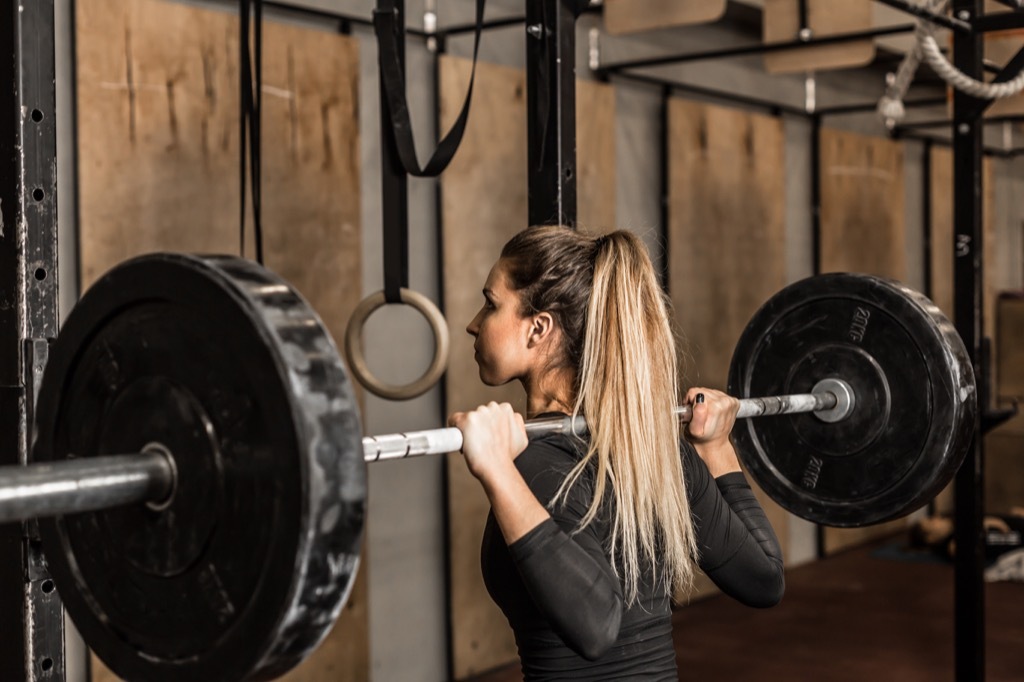 build muscle fast woman squatting