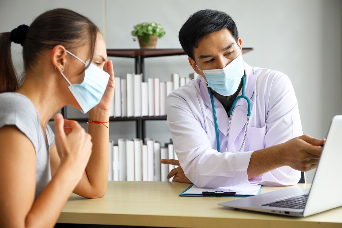 Woman talking to doctor