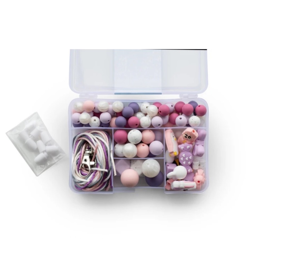 pink and purple silicone beads in clear box