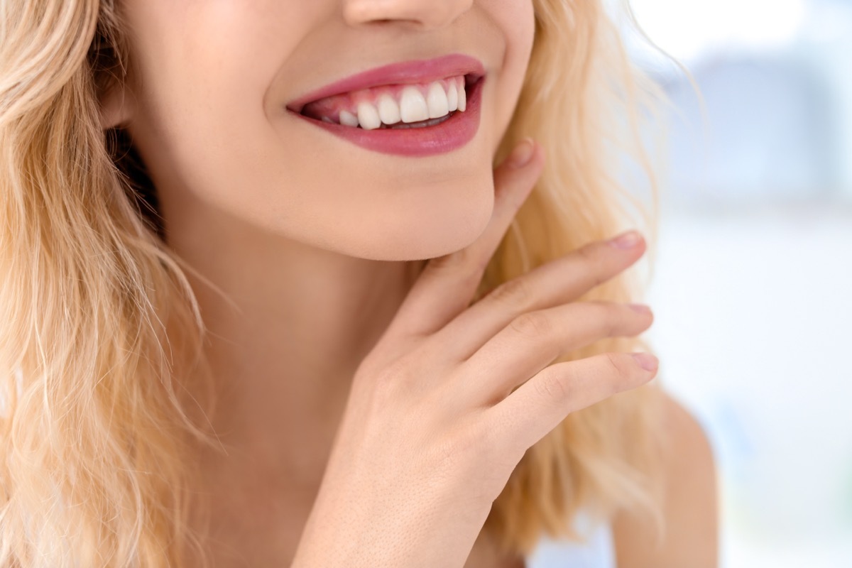 Young woman with beautiful smile indoors.