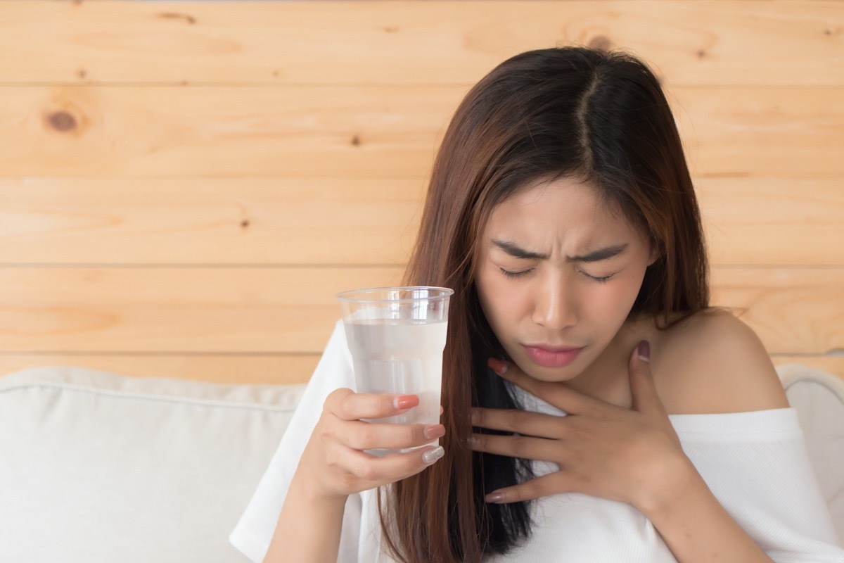 choking woman while drinking water