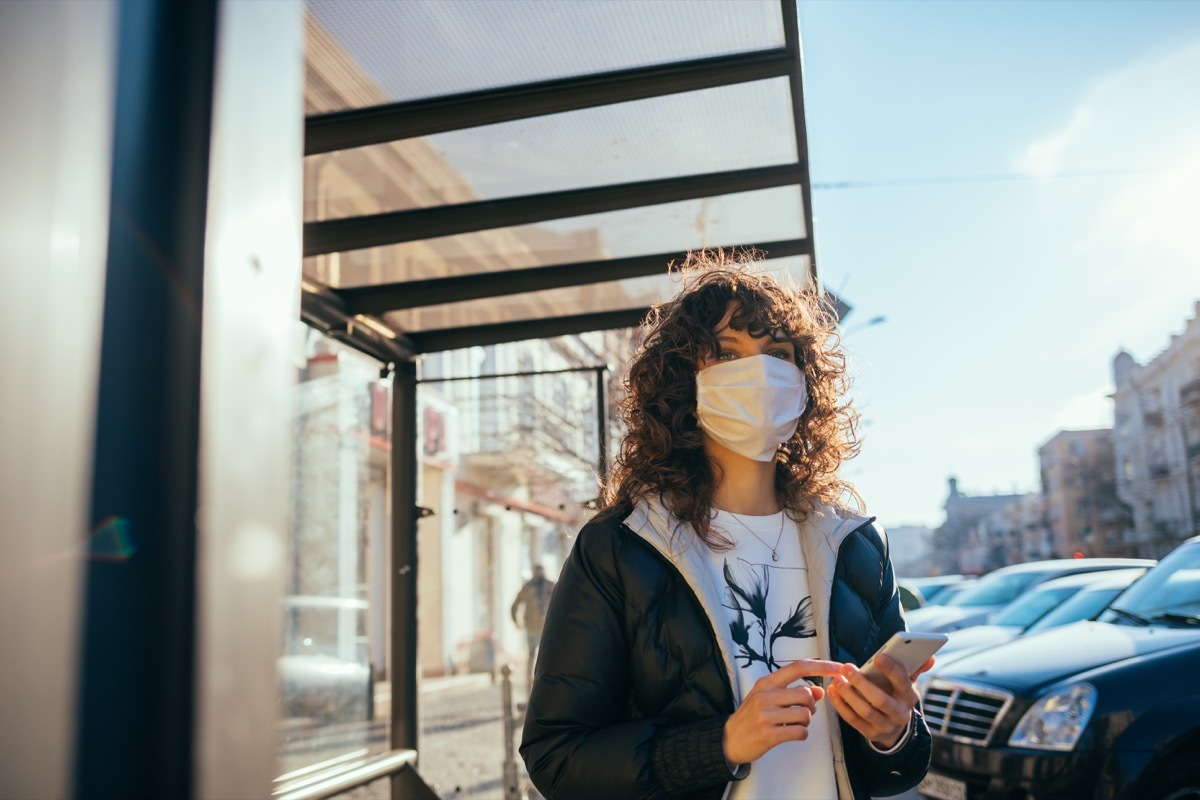 Woman wearing a mask outside