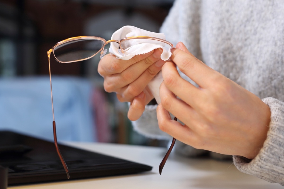 woman cleaning eye glasses, old school cleaning tips