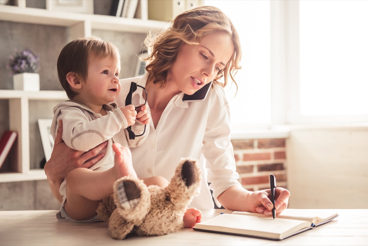 Busy mom on the phone, doing work, and with baby