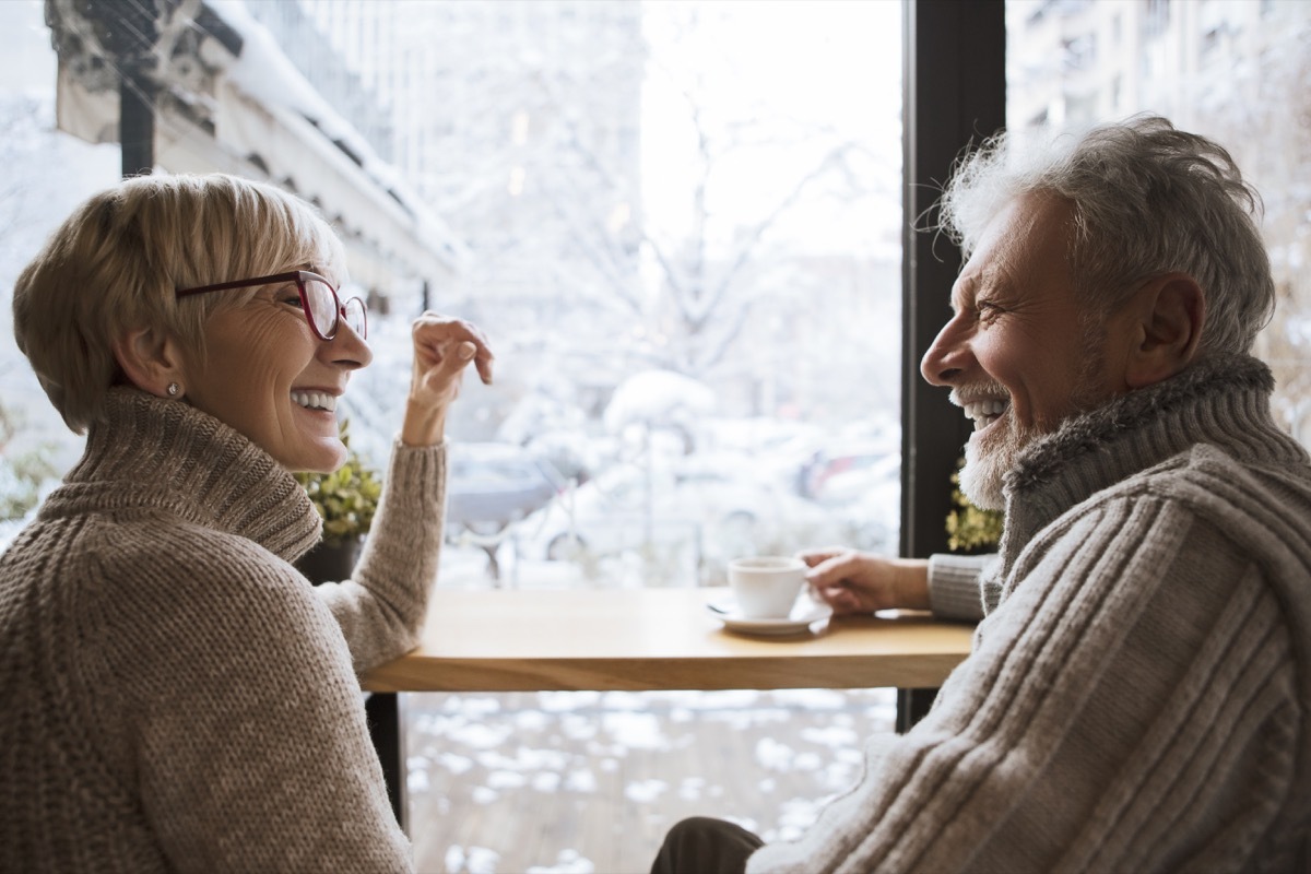 two older people in front of a mirror on a coffee date