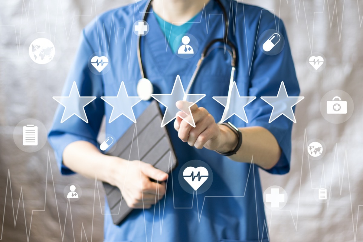 Doctor pushing button key rating increase virtual healthcare in network medicine