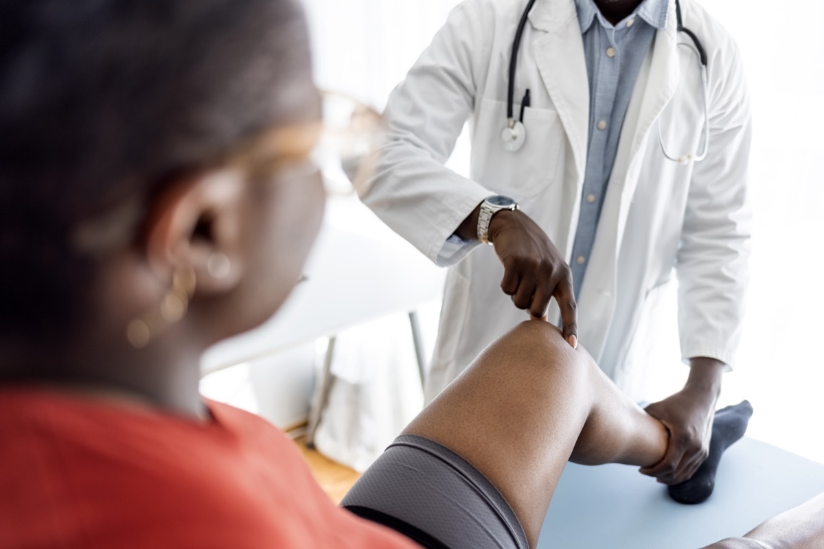 Shot of a handsome young male physiotherapist doing a consultation and assessment with a female patient.