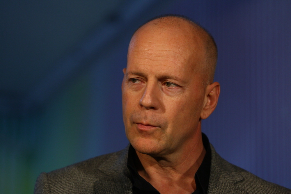 A closeup of Bruce Willis during a premier