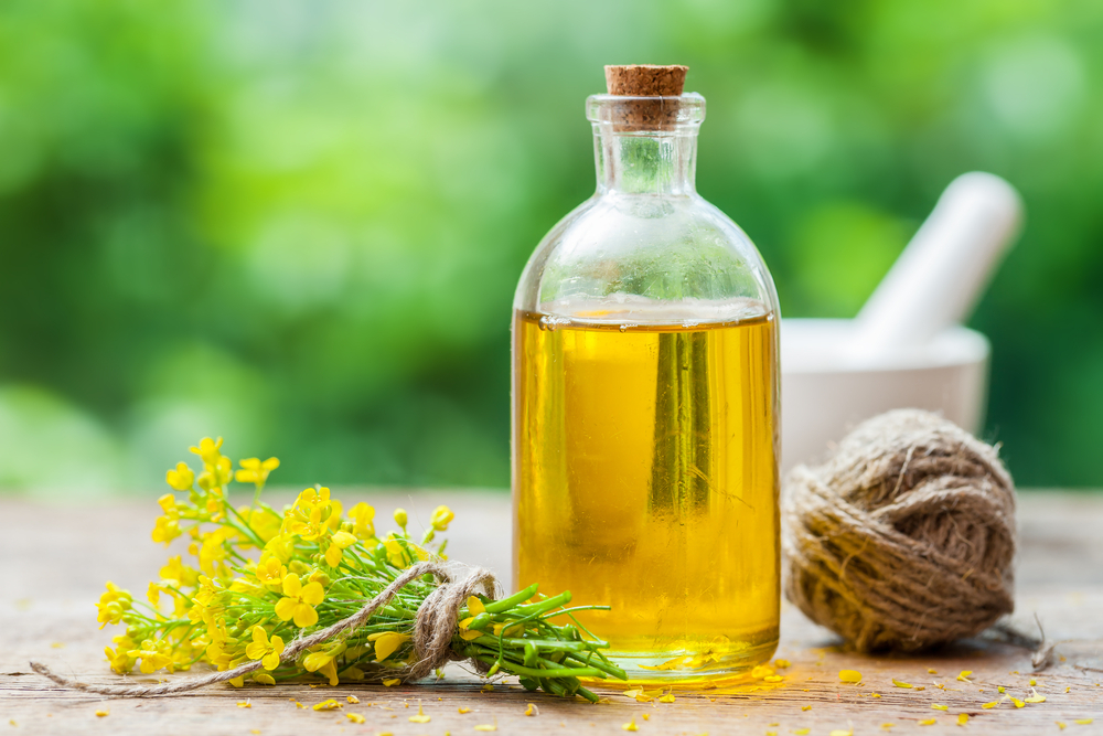 canola oil on a wood table outside