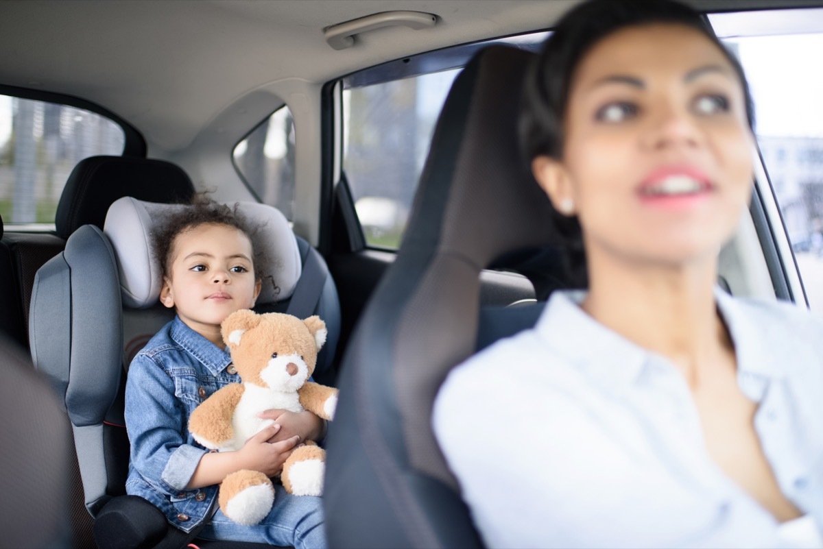 Kid and mother in car