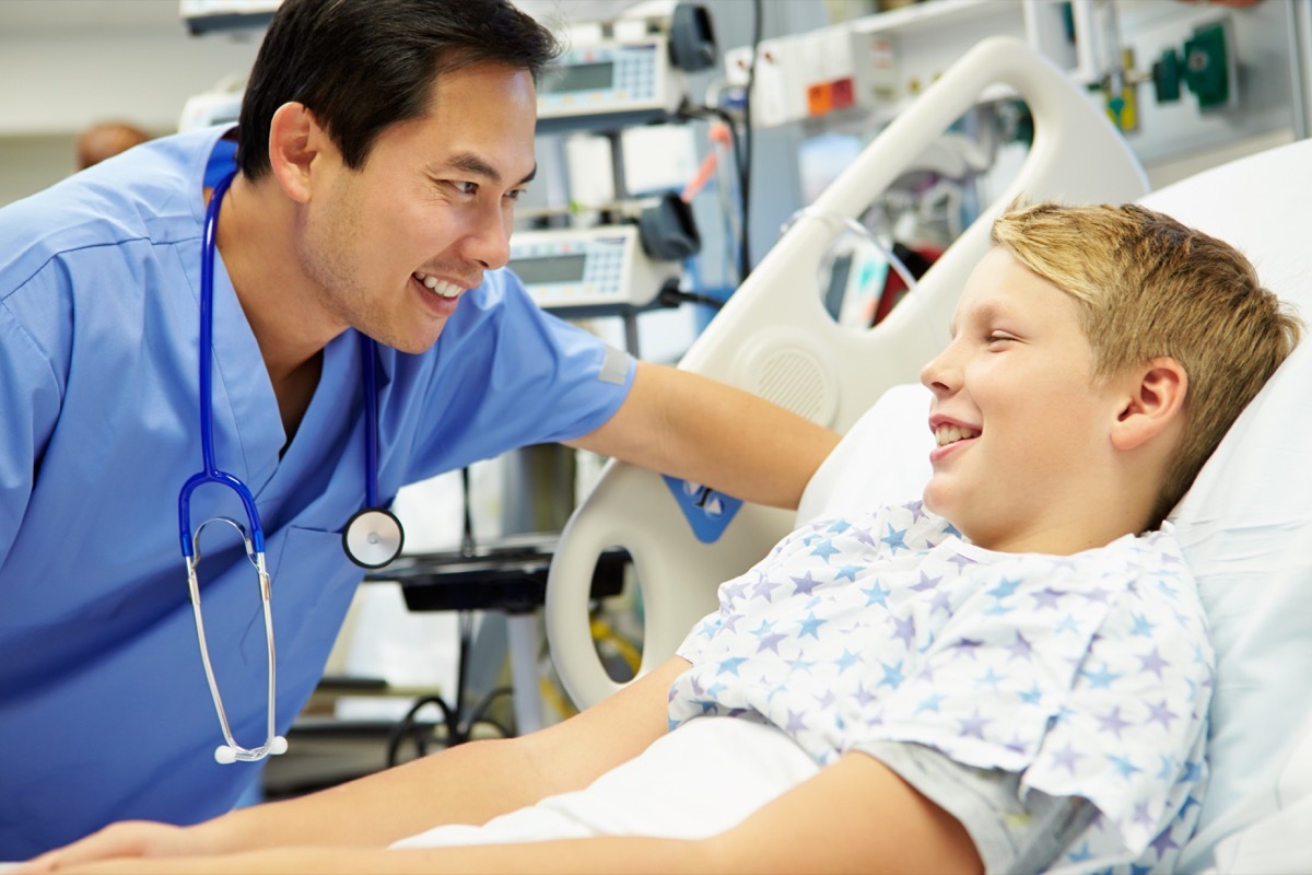 Boy Talking To Male Nurse In Emergency Room