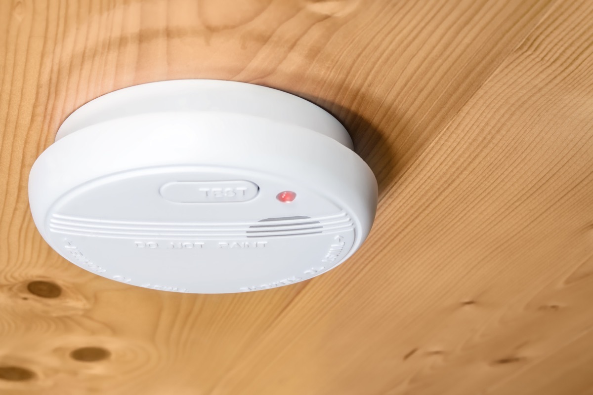 smoke alarm on a wood ceiling