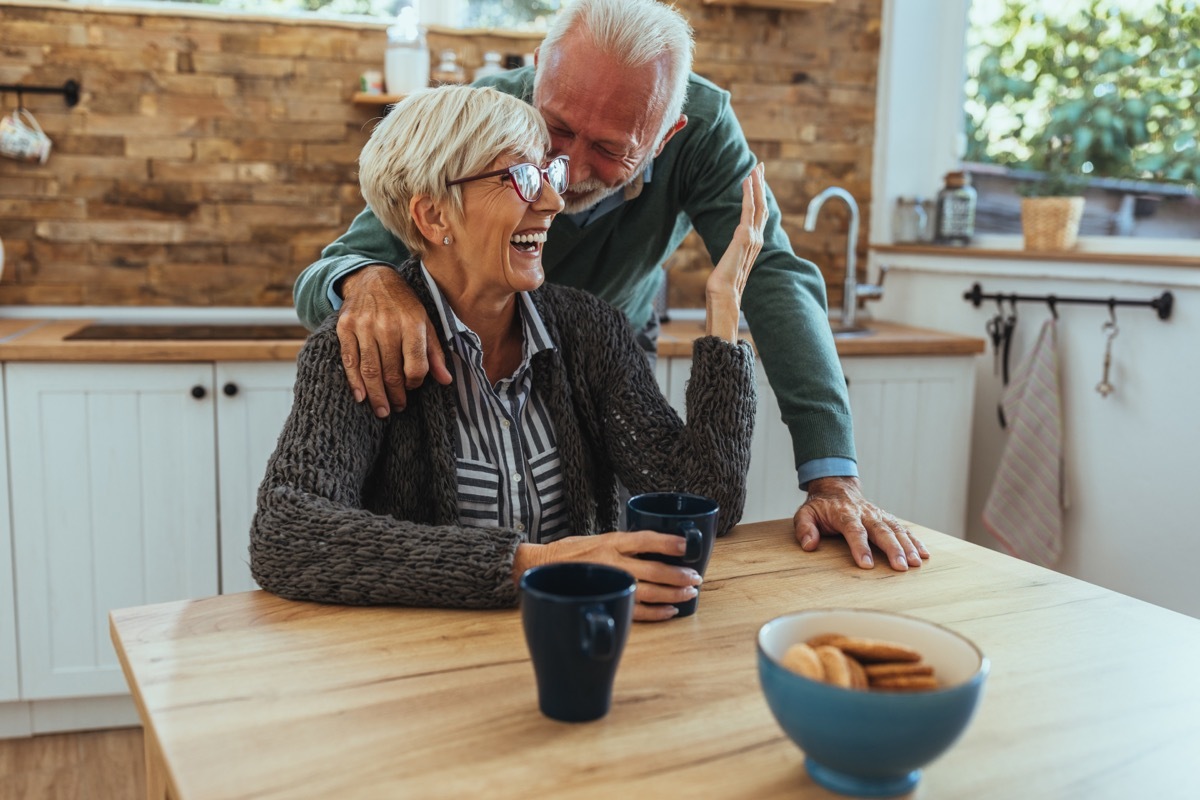 older couple sitting at table together