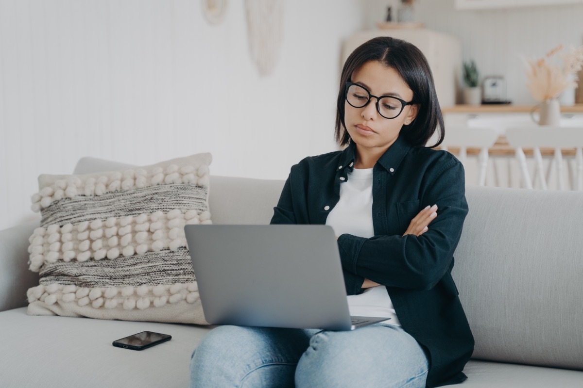 woman looking skeptical at computer