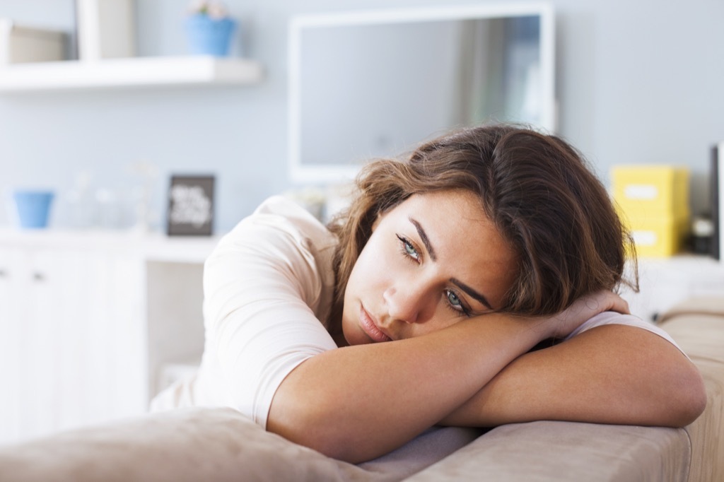 Woman is Sad on the Couch {Daylight Saving}