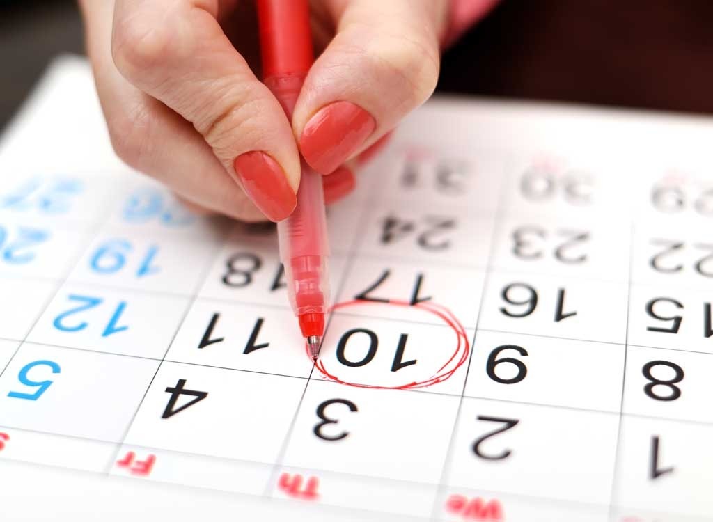 woman marking calendar