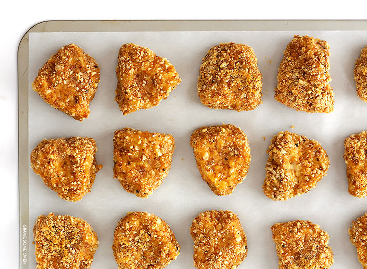 almond-crusted chicken nuggets on baking tray