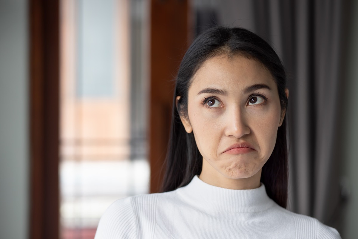 Upset Woman Rolling Her Eyes