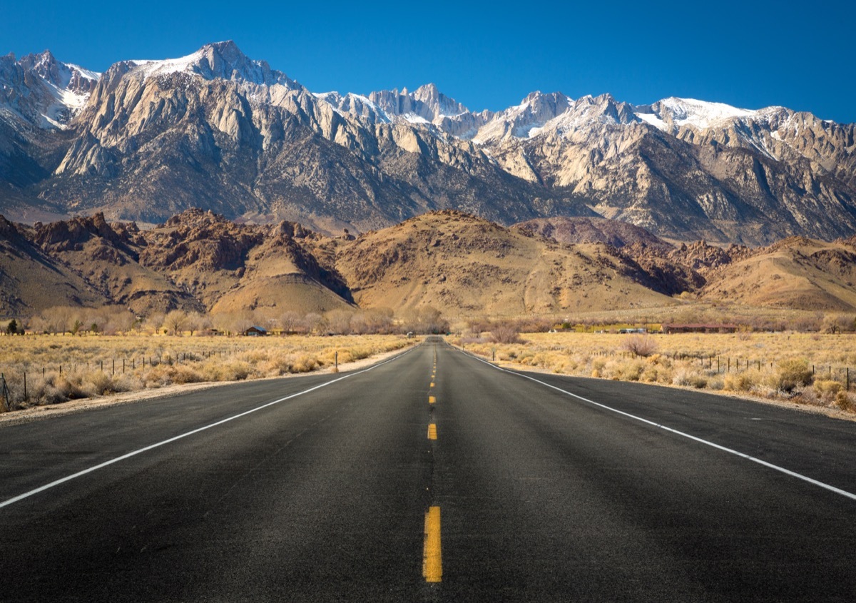 Mt Whitney sits at the end of a straight empty road, state fact about California