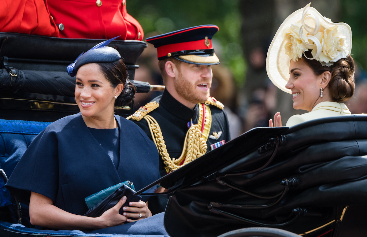 Prince Harry, Duke of Sussex. Meghan, Duchess of Sussex and Catherine, Duchess of Cambridge ride by carriage down the Mall during Trooping The Colour, the Queen's annual birthday parade, on June 08, 2019 in London, England.