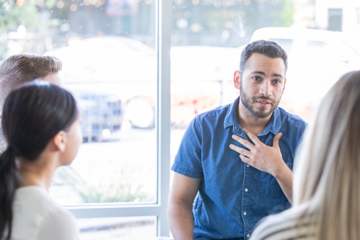 Man talking during a support group meeting