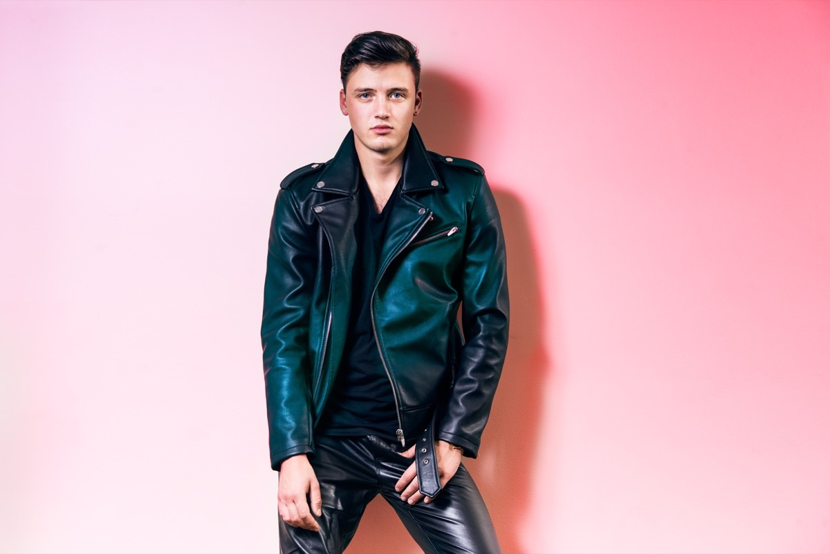 man wearing leather pants and a leather biking jacket