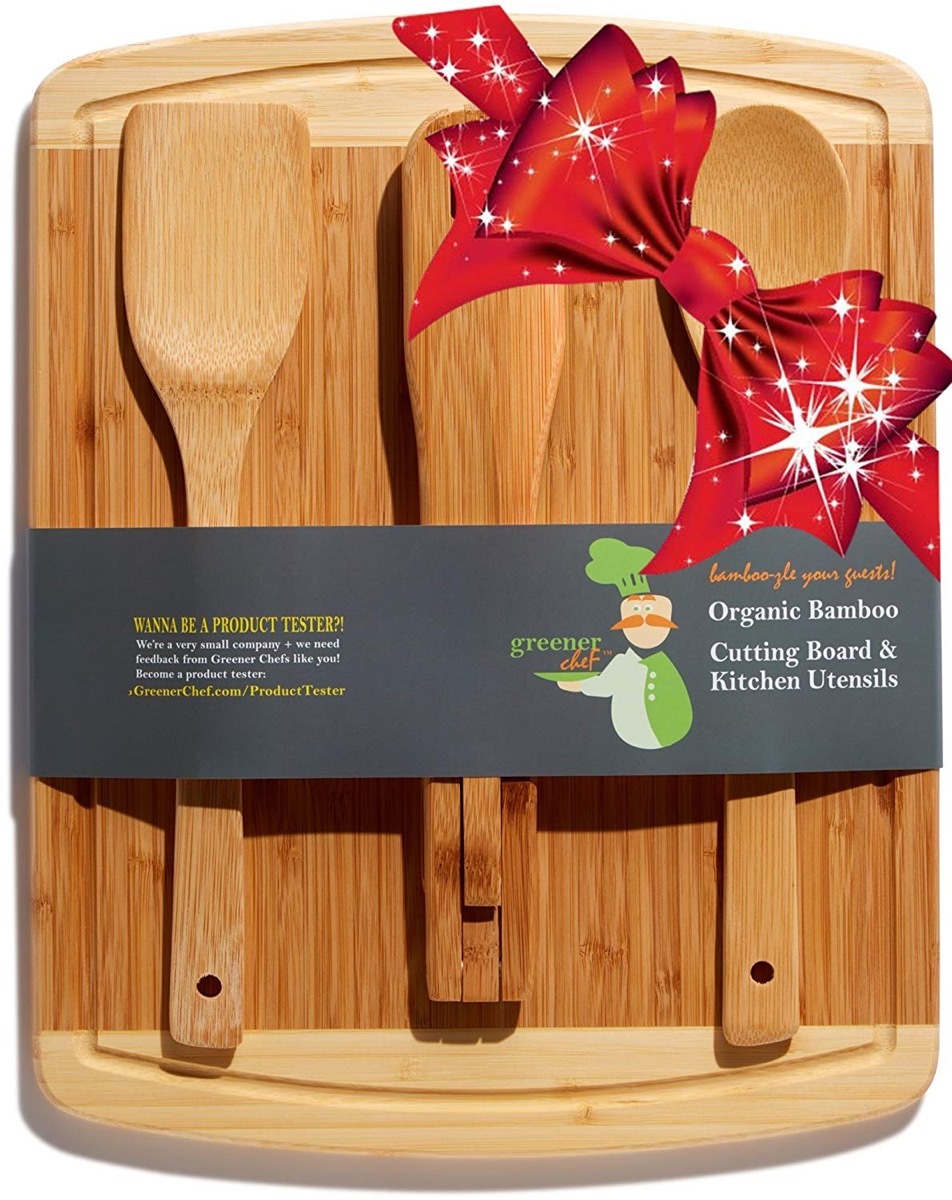 wooden cutting board with three spatulas on it