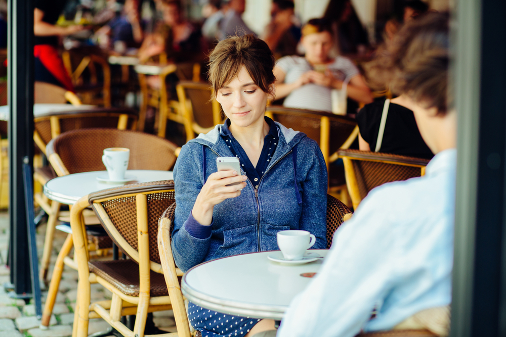 woman texting on date