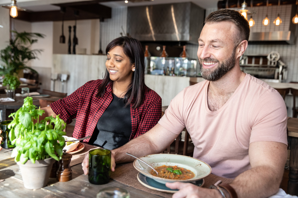 young couple enjoying soup