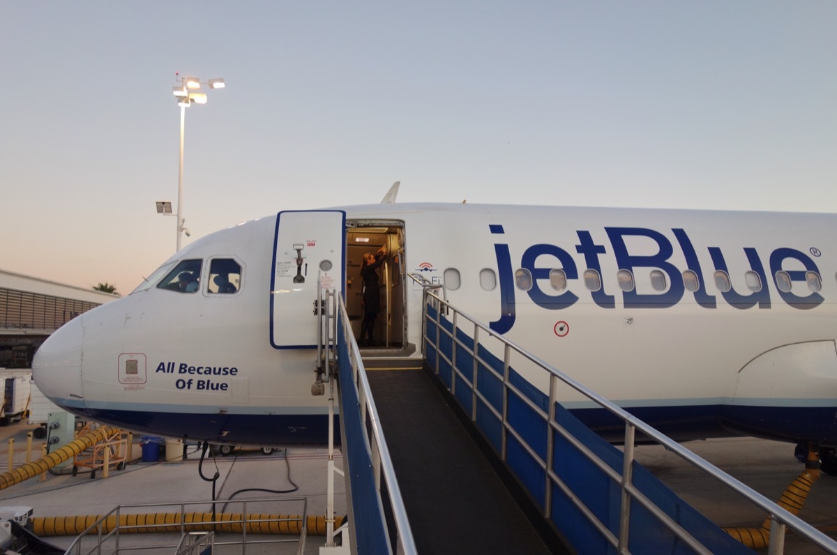 LOS ANGELES, CA -17 JUL 2017- View of a JetBlue (B6) airplane on the tarmac at sunset at the Long Beach Airport (LGB), formerly Daugherty Field, a focus city for JetBlue Airways.