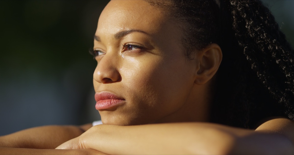 unhappy woman crying outdoors