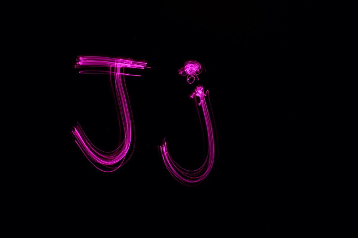 Uppercase and lowercase letter j in pink neon