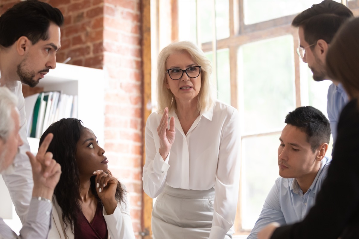 senior businesswoman leading a meeting