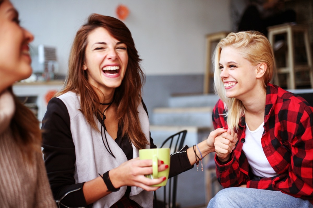 Friends having fun in a cafe.