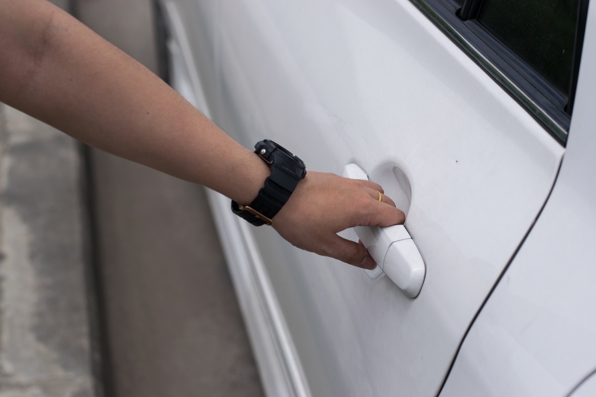 Person Opening a Car Door Inside of Their Garage DIY Home Hacks