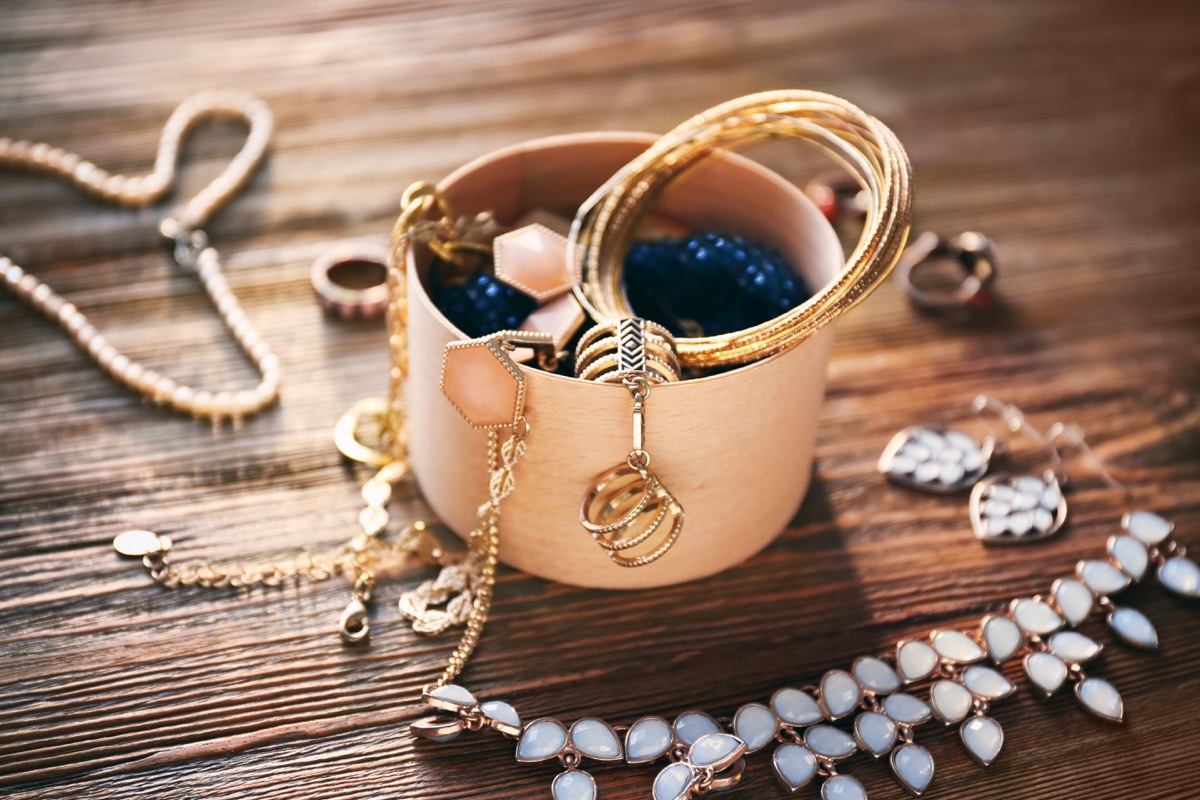 old jewelry on a wooden attic floor things to throw away