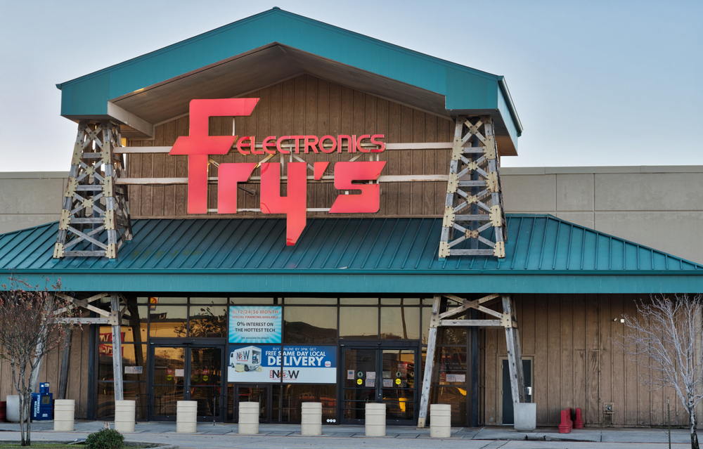 The entrance of a Fry's Electronics store with green awnings and red lettering