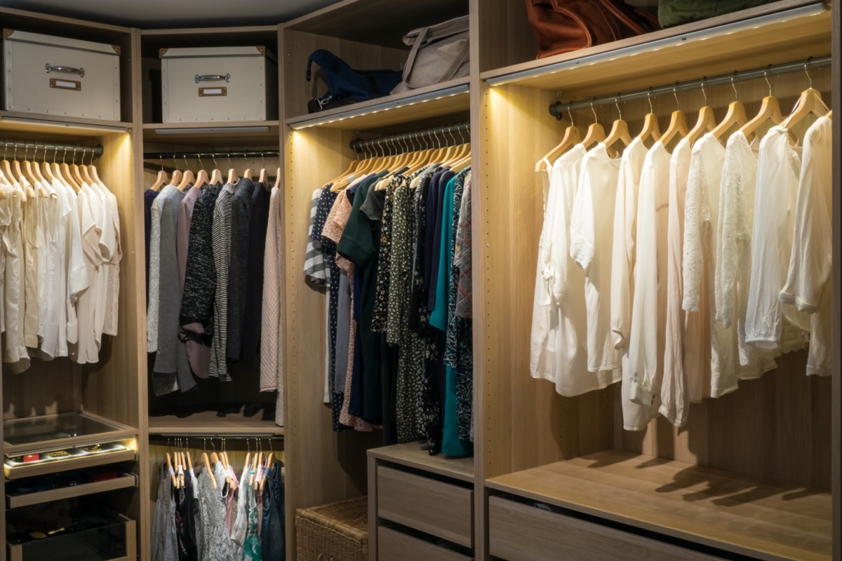 Luxury walk in closet / dressing room with lighting and jewel display.