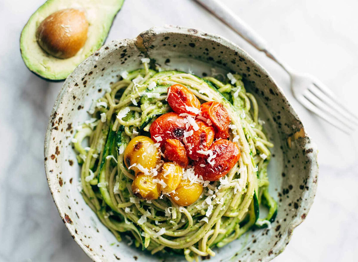 zucchini pasta with tomatoes and avocado sauce