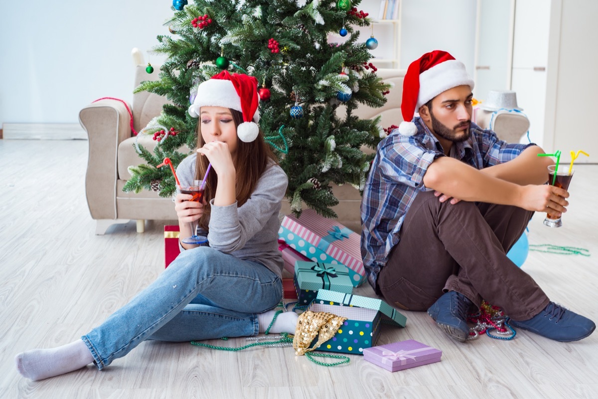 couple arguing and looking upset on Christmas