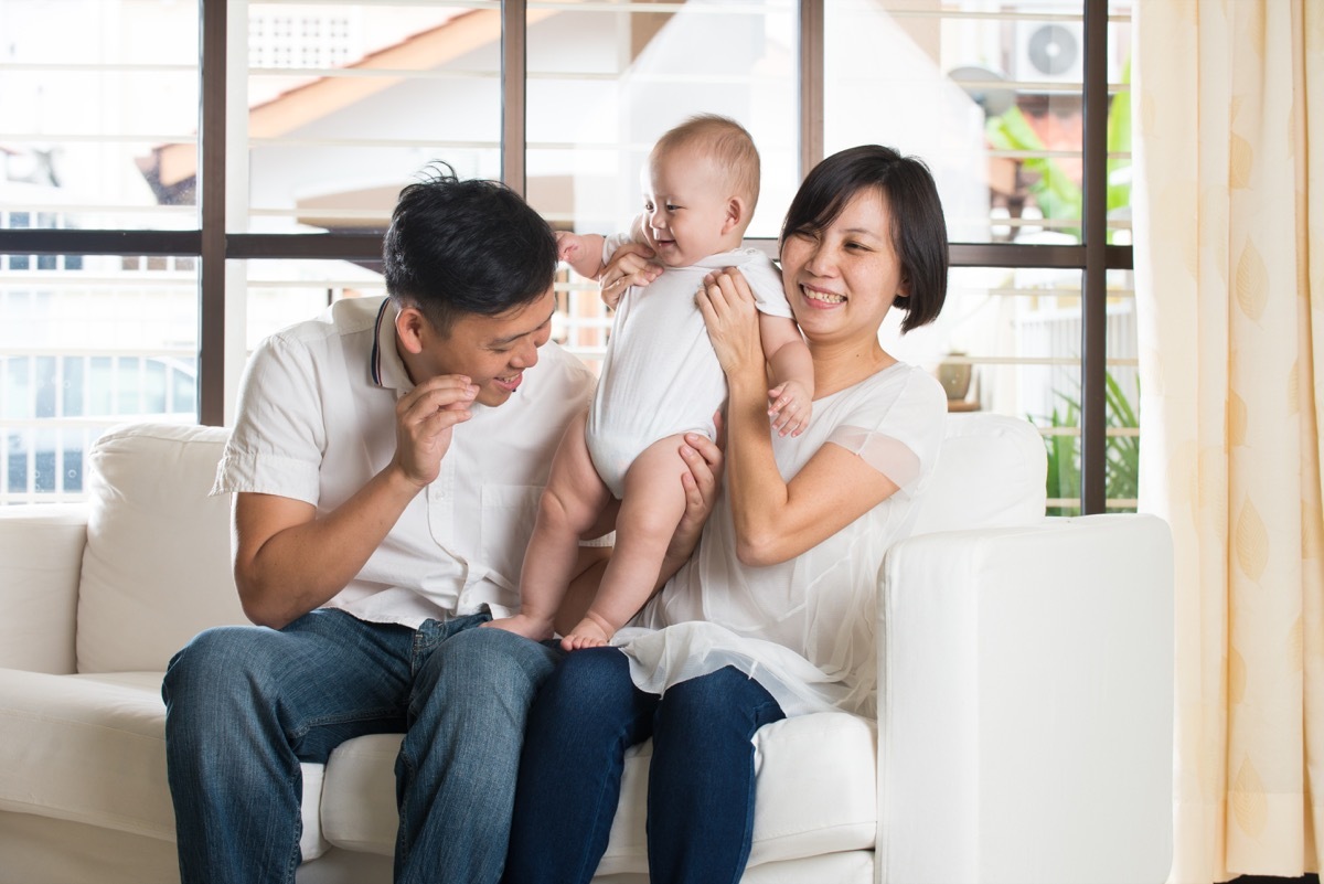 asian parents with young baby