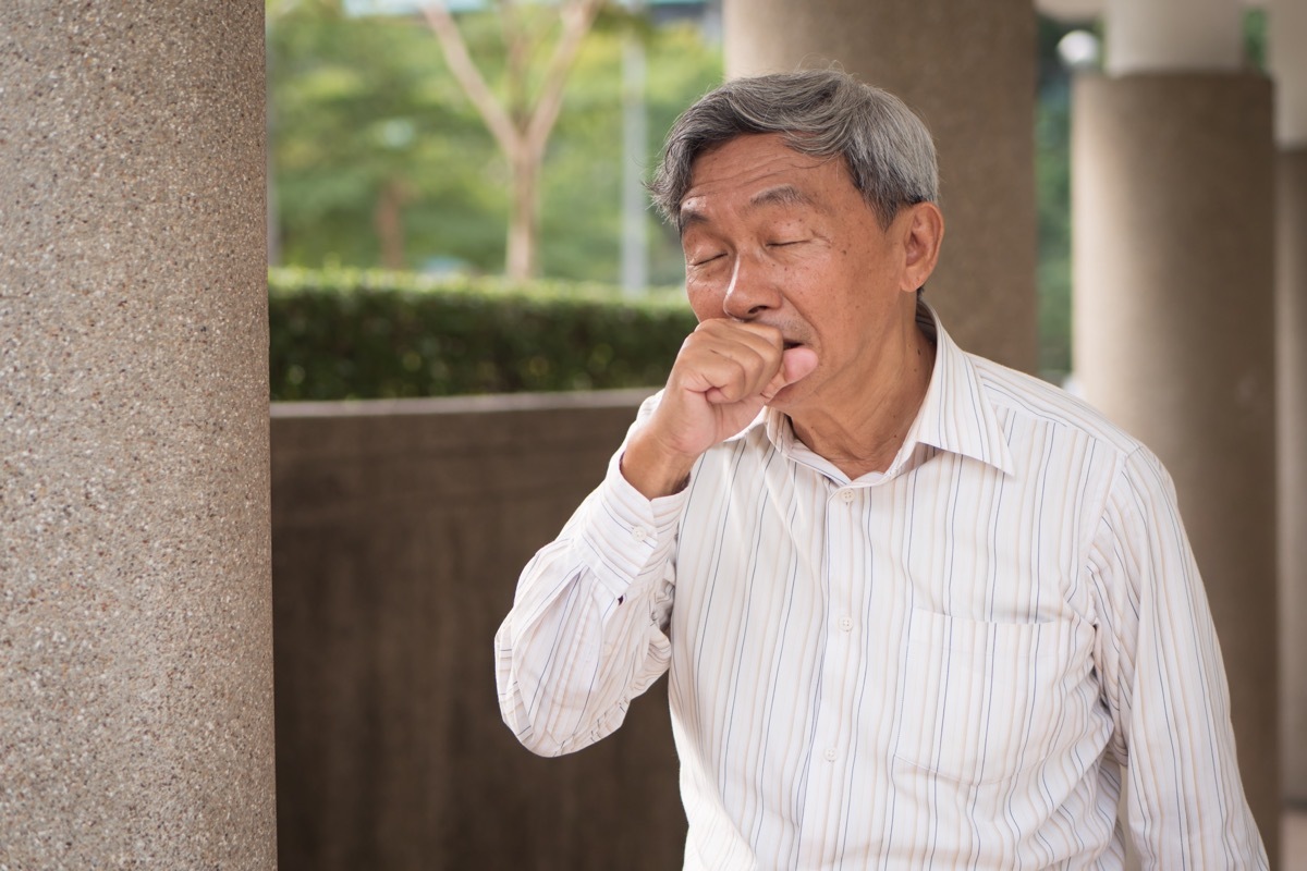 sick man coughing outside men's health concerns over 40