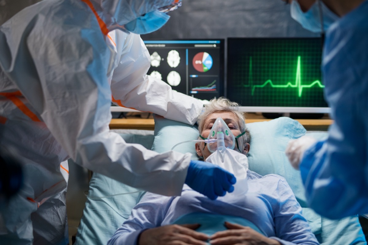 Infected patient in quarantine lying in bed in hospital, coronavirus concept.