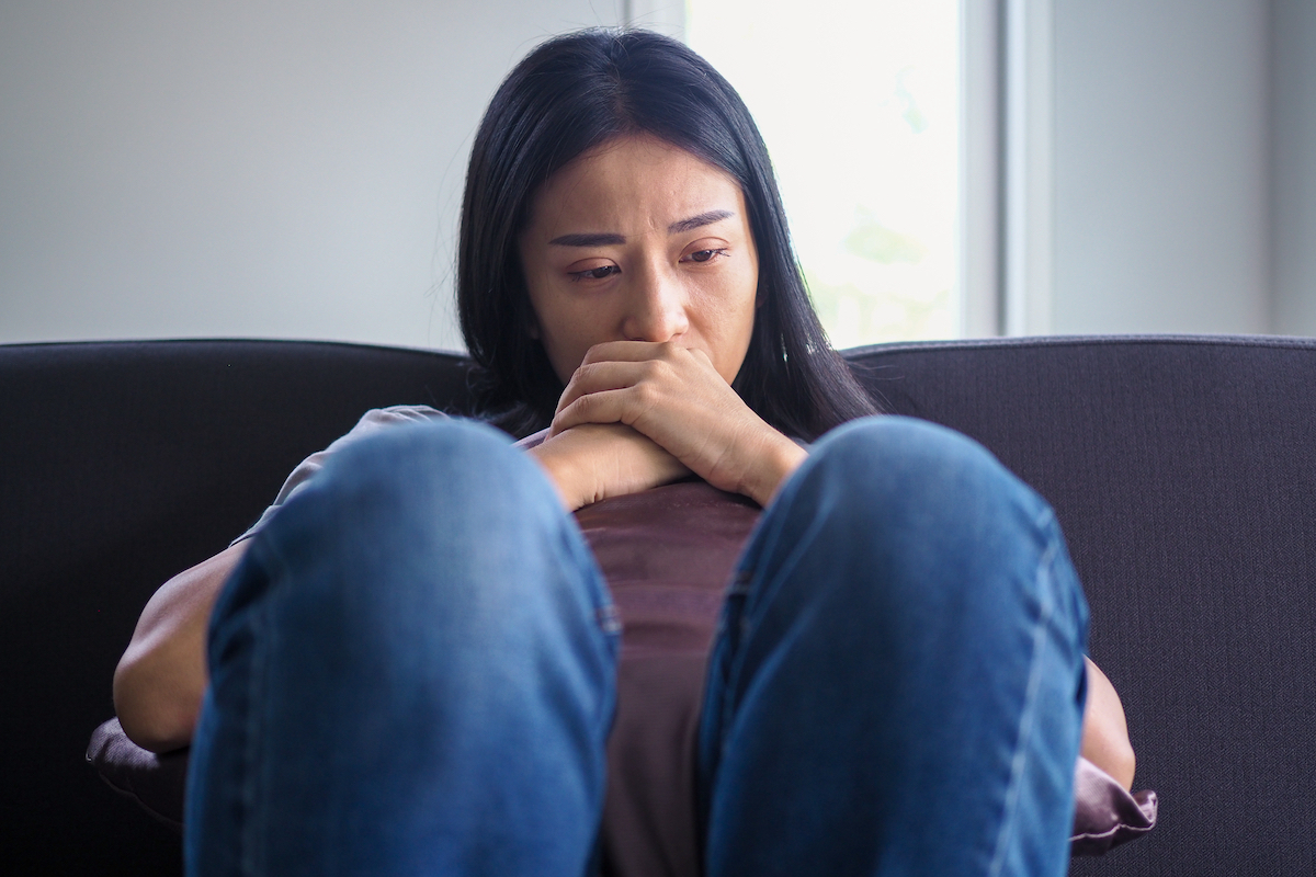 Woman frustrated on the couch