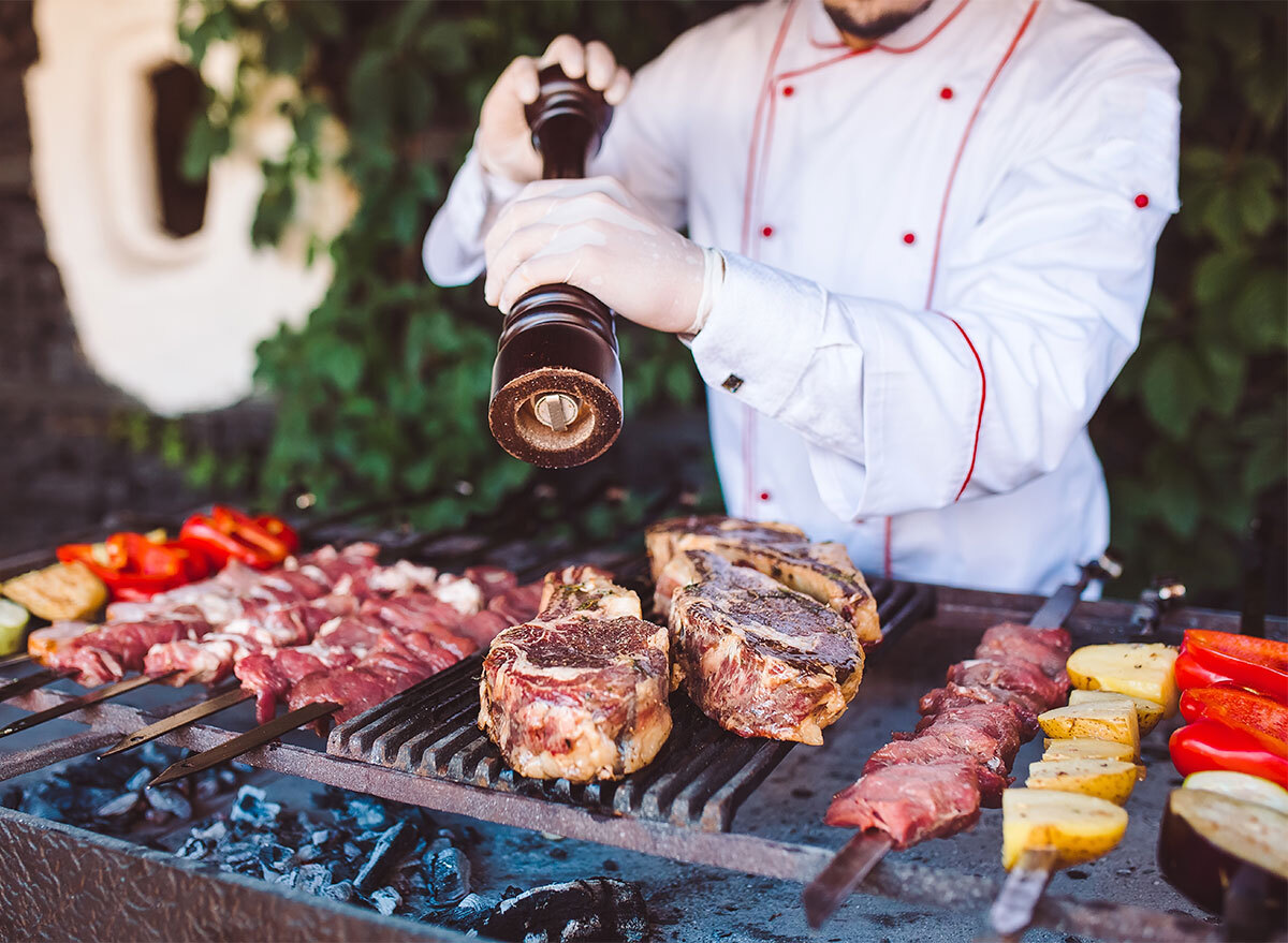 chef grilling meat and vegetables