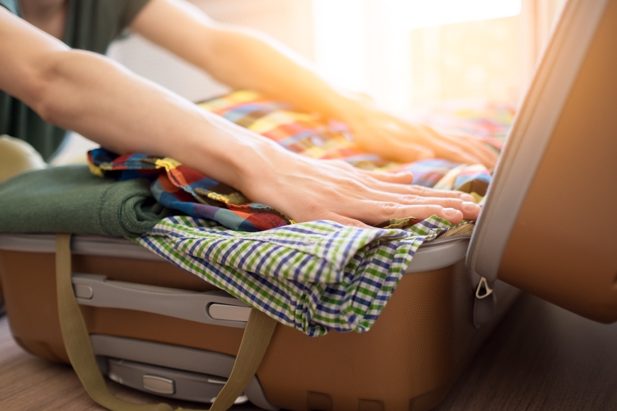 Woman packing a suitcase