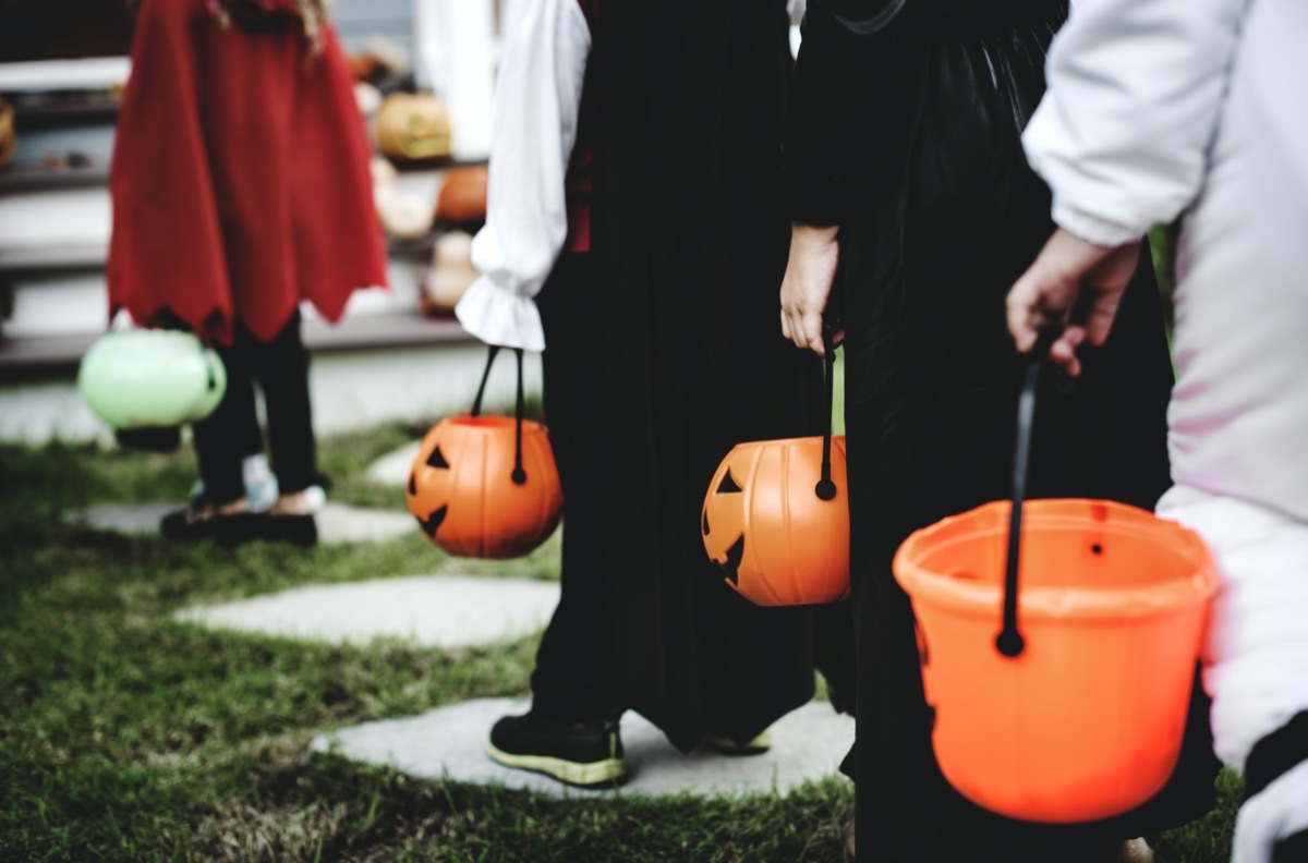 Little children in Halloween costumes