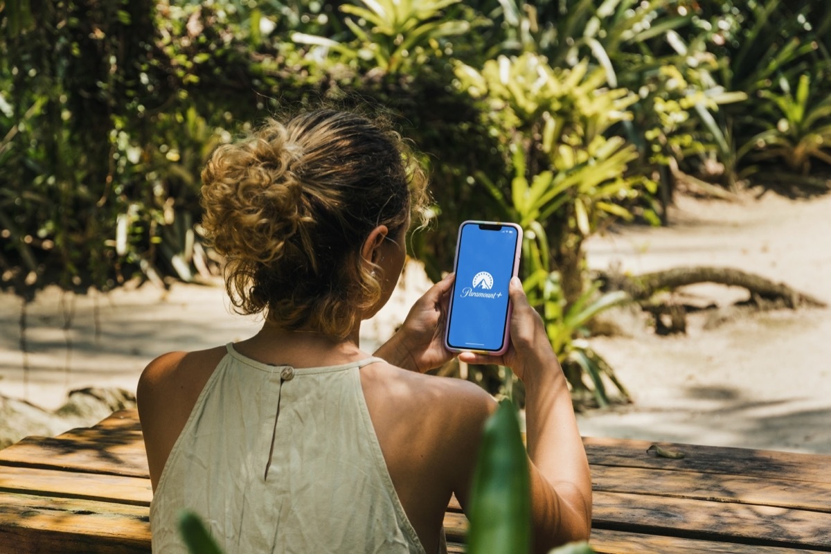 woman watching paramount plus on smartphone