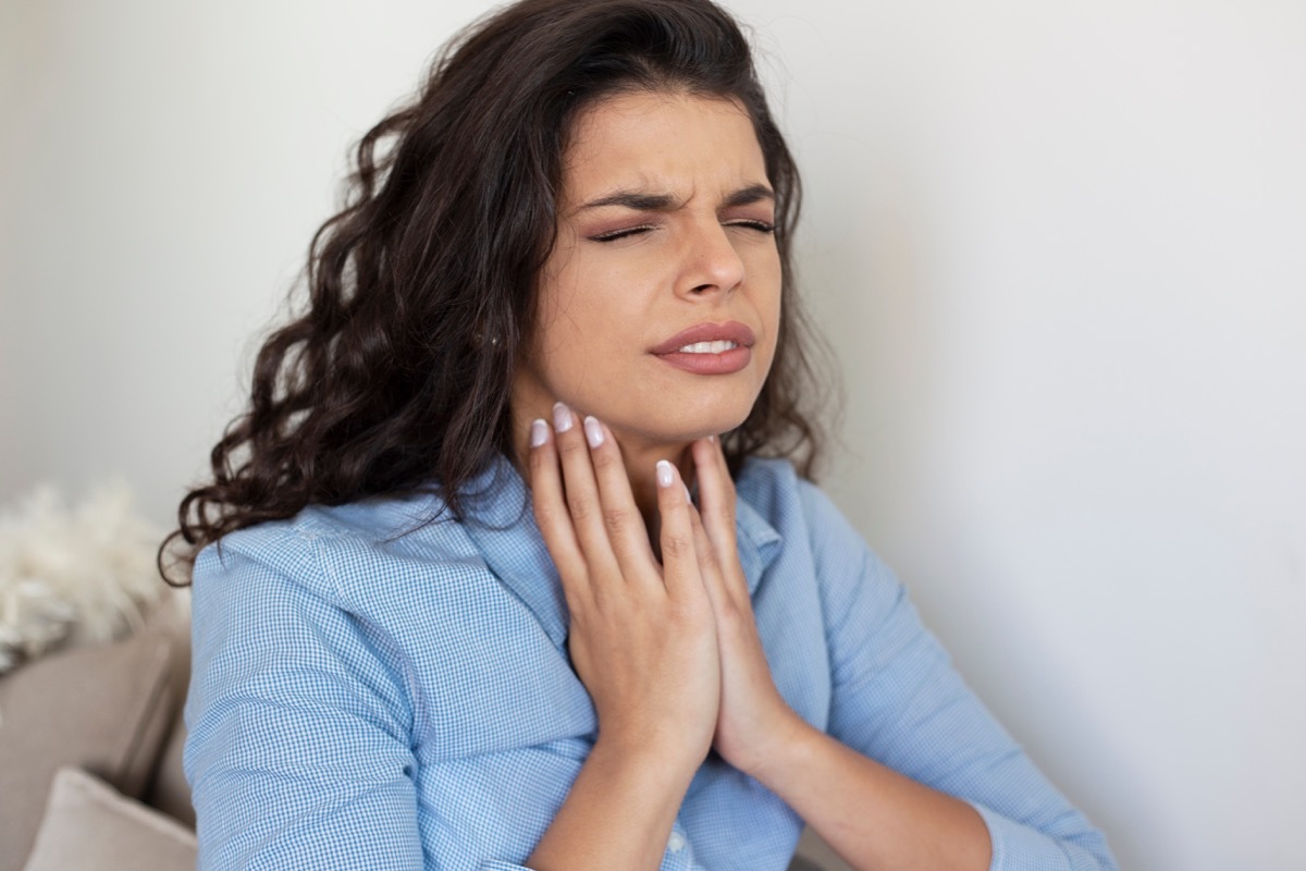 woman with throat pain