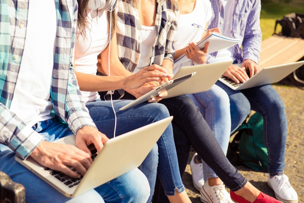 students on laptops and tablets